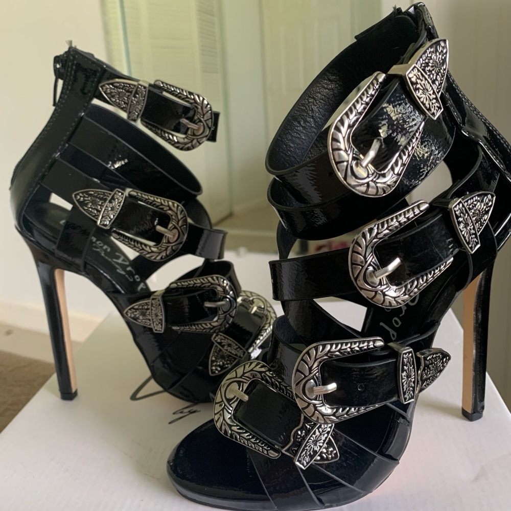 Black strap buckle heels